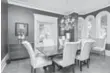  ??  ?? The formal dining room features two large bay windows.