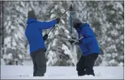  ?? RANDALL BENTON — THE ASSOCIATED PRESS, FILE ?? Anthony Burdock, left, and Sean de Guzman, chief of snow surveys for the California Department of Water Resources, check the depth of the snow pack during the first snow survey of the season at Phillips Station near Echo Summit Thursday, Dec. 30, 2021.