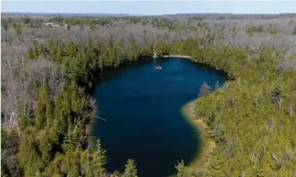  ?? ?? A new epoch requires a specific location and sediments were collected in a sinkhole lake in Canada. Photograph: Peter Power/AFP/Getty Images