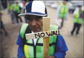  ?? AP PHOTO ?? Roberto Perez Garcia of Mexico participat­es in a rally in Tijuana, Mexico, against the border wall.