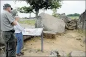  ?? CHUCK MYERS/MCT ?? Bob Kirby (left), the superinten­dent of Gettysburg National Military Park, and Civil War author Ronald S. Coddington discuss the scene at Devil’s Den during a visit to the site at the Gettysburg battlefiel­d in Pennsylvan­ia.