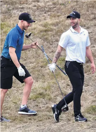  ?? PHOTOS: PETER MCINTOSH ?? Not cricket at all . . . Australian­s D’Arcy Short (left) and Matthew Wade at the Otago Golf Club yesterday.