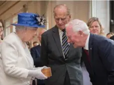  ?? TIM P. WHITBY/GETTY IMAGES ?? Gov. Gen. David Johnston, right, thanked the Queen for her “65 years as our sovereign” on Wednesday.