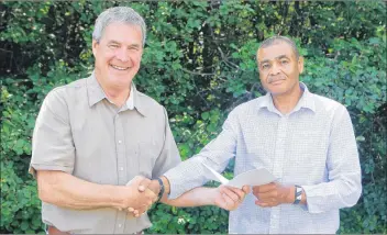  ??  ?? Clare-Digby MLA Gordon Wilson presents the deed to Kerry Johnson, chair of JACBA.