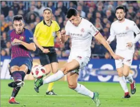  ?? AP PHOTO ?? ■ Barcelona's Munir El Haddadi (left) scores against Leonesa in a Copa de Rey Round of 32 game.