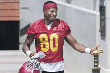  ?? Luis Sinco Los Angeles Times ?? DEONTAY BURNETT, who had a huge game in the Rose Bowl, touches the Sword of Troy on Saturday.