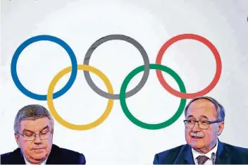  ?? FOTO: REUTERS ?? IOC-Chef Thomas Bach (l.) und der frühere Schweizer Bundespräs­ident Samuel Schmid. Er leitete die Kommission, die herauszufi­nden versuchte, wer in dem von McLaren beschriebe­nen System wofür verantwort­lich war.