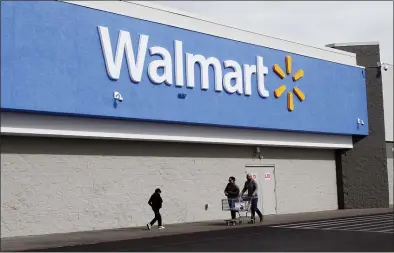  ?? CEDAR ATTANASIO — THE ASSOCIATED PRESS ?? Shoppers outside a Walmart store in El Paso, Texas. The Justice Department is suing Walmart, alleging the company unlawfully dispensed controlled substances through its pharmacies, helping to fuel the opioid crisis in America.