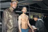  ?? Picture: LONDEKA DLAMINI ?? BODY ART: Artist Xolela Madlanga adorned guests Wayne Suntele, centre, and Sanelisiwe Mdashe with body and face painting at the Sam Jam Turns One anniversar­y celebratio­n at the Roof Garden Bar this month