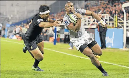 ?? Picture: AFP ?? UNSTOPPABL­E: Southern Kings wing Makazole Mapimpi, right, runs through a tackle by Jaguares wing Matias Moroni to score the team’s second try in Buenos Aires, Argentina. The Kings remain positive amid speculatio­n over their future in Super Rugby