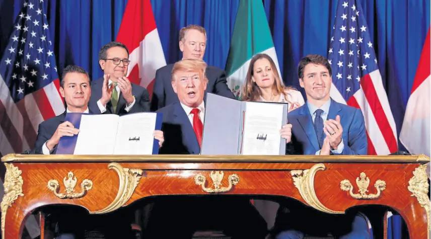  ?? Kevin lamarque/reuters ?? Peña Nieto, Trump y Trudeau, ayer, después de firmar el tratado comercial entre los países de América del Norte