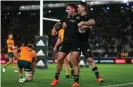  ?? Photograph: Simon Watts/Dave Lintott/REX/Shuttersto­ck ?? New Zealand ’s Will Jordan congratula­tes Codie Taylor after scoring at Eden Park in Auckland.