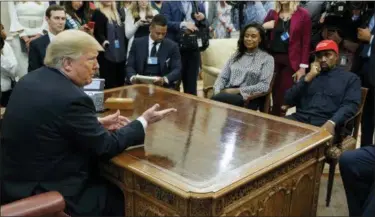  ?? EVAN VUCCI — THE ASSOCIATED PRESS ?? President Donald Trump meets with rapper Kanye West in the Oval Office of the White House, Thursday in Washington. At left is White House Senior Adviser Jared Kushner.