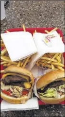  ?? KESSLER / AJC
JOHN ?? The Double-Double animal-style (left) and the cheeseburg­er at InN-Out Burger in Los Angeles.