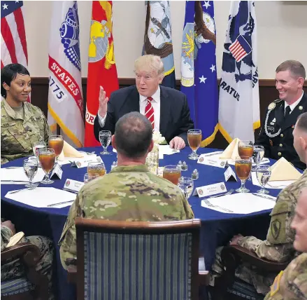  ?? MANDEL NGAN / AFP / GETTY IMAGES ?? U. S. President Donald Trump has lunch with troops during a visit to the U. S. Central Command at MacDill Air Force Base in Tampa in February.