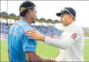  ?? GETTY ?? ▪ Joe Root and Shannon Gabriel shake hands after the match.