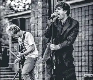  ?? RITCHIE PEREZ PHOTO ?? Event organizer Andrew Waterman captivated the crowd as a frenzied frontman at the Bowring Park Amphitheat­re.