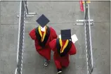  ?? SETH WENIG-ASSOCIATED PRESS FILE ?? New graduates walk into the High Point Solutions Stadium before the start of the Rutgers University graduation ceremony in Piscataway Township, N.J., on May 13, 2018.