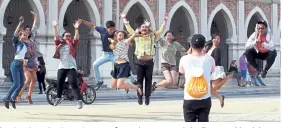  ??  ?? Tourists jumping in excitement for a photo around the Dataran Merdeka area. Matta said 25.95 million foreign visitors spent RM82.1bil in Malaysia last year.