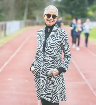  ?? JASON PAYNE ?? Valerie Jerome visits West Vancouver secondary school's track, which will be renamed for her late brother Harry, once the fastest man in the world, who set seven world records during his career.