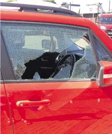  ??  ?? One of the damaged cars, left, which was targeted at the Lipscomb dealership off Chart Road