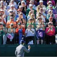  ?? ASSOCIATED PRESS ?? In this file photo, Jordan Spieth holds up his ball to the patrons after a birdie on the eighth hole during the third round of the Masters golf tournament in Augusta, Ga. Golf is getting younger, and the PGA Tour is going after its slice of the new...