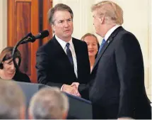  ??  ?? President Donald Trump shakes hands with Judge Brett Kavanaugh, his Supreme Court nominee, Monday in the East Room of the White House in Washington.