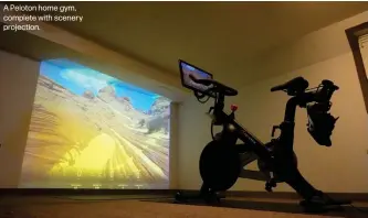  ??  ?? A Peloton home gym, complete with scenery projection.