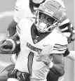  ?? DENNIS NETT/AP ?? Liberty running back Shedro Louis rushed for a career-high 170 yards Saturday against Syrcause.
