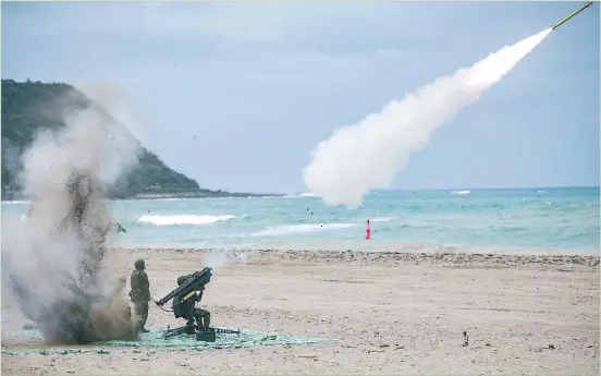  ?? PHOTO: AP ?? Above: Taiwanese soldiers launch a missile from a US made FIM 92 Stinger man-portable air defense system (AKA MANPAD) with dual launchers, during live fire exercises in Pingtung County, on April 16.