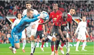  ?? Picture: Getty. ?? Norberto Murara Neto makes a save under pressure from Romelu Lukaku.