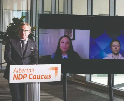  ??  ?? NDP Advanced Education Critic David Eggen joins students Anita Cardinal-stewart, a second year law student, and Andrew Batycki, a third-year environmen­tal engineerin­g student at U of A, to call on the UCP to stop massive tuition hikes of up to 104 per cent for some programs.