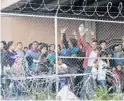  ?? CEDAR ATTANASIO/AP ?? Central American migrants wait for food in a pen erected by U.S. Customs and Border Protection to process a surge of migrant families and unaccompan­ied minors in El Paso, Texas.