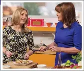  ??  ?? BALANCE: Lorraine cooking on her TV show