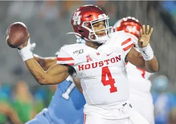  ?? Jonathan Bachman / Getty Images ?? Houston’s D'Eriq King has thrown for 663 yards and six touchdowns and rushed for 312 yards and six more scores in four games this season, but the Cougars are off to a 1-3 start.