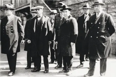  ?? Associated Press ?? Bartolomeo Vanzetti (second from left, foreground) and Nicola Sacco are seen handcuffed shortly before their 1927 executions.