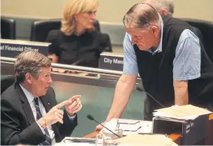  ?? STEVE RUSSELL TORONTO STAR FILE PHOTO ?? Coun. Jim Karygianni­s, right, was first removed from office last November after his campaign financial statement showed he had exceeded a strict spending limit in the city’s 2018 election.