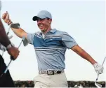  ?? MIKE EHRMANN GETTY IMAGES ?? Rory McIlroy celebrates after winning the TaylorMade Driving Relief charity skins match on Sunday.