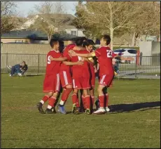  ?? MERISA JENSEN/Valley Press ?? HUG IT OUT — The Paraclete boys soccer players swarm Matthew Martel, center, after he converted a free kick to put the Spirits up 3-0 over Sierra Canyon in the second half on Thursday. Matthew Hong (23) scored the other three goals for Paraclete in its 4-0 Gold Coast League victory on senior night.