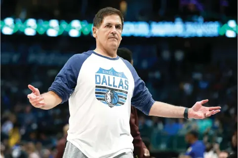  ?? (Tim Heitman/getty Images/tns) ?? Dallas Mavericks owner Mark Cuban reacts March 22 during a break in action against the Golden State Warriors at American Airlines Center in Dallas.