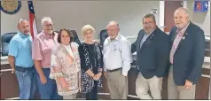  ?? Jeremy stewart ?? The Polk County Board of Commission­ers pose for a photo with retiring County Clerk Dawn Turner after honoring her with a proclamati­on at its meeting on Tuesday, April 6, 2021.