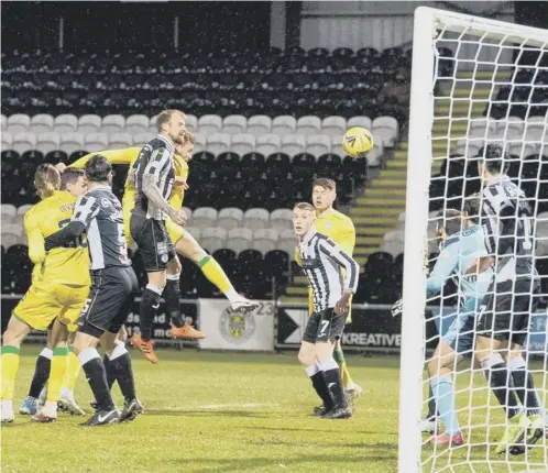  ??  ?? 0 Ryan Porteous rises above the St Mirren defence to head home Hibs’ opener in their 2-1 win last night.