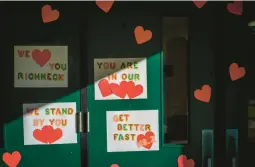  ?? JOHN C. CLARK/AP ?? Messages of support for teacher Abby Zwerner grace the front door Monday of Richneck Elementary School in Newport News, Va. Zwerner was shot by a student.