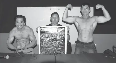  ?? SETH DELOS REYES ?? BODYBUILDE­RS. Left, Jess Serafica, United Bodybuildi­ng Associatio­n (UBA) vice-president Rhotelo Labestre and Jemie Adjad flex their muscles after the Davao Sportswrit­ers Associatio­n (DSA) Forum held yesterday at the NCCC Mall Davao B3 Center family room.