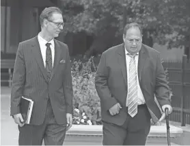  ?? PHOTOS BY SHAWN DOWD/ROCHESTER DEMOCRAT AND CHRONICLE ?? Steven Rosenbaum, right, leaves the federal courthouse with his attorney Peter Pullano in August. Rosenbaum received a sentence identical to retired Alan Laird.