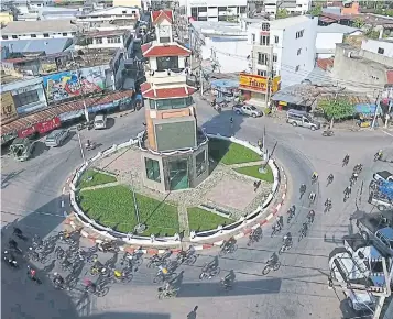  ??  ?? Cyclists pass through the centre of Phol district in Khon Kaen. Developers see a slow 2019 in the province.