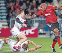  ?? Photo: GETTY IMAGES ?? Crusaders wing Nemani Nadolo brushes aside the tackle of James O’Connor on his way to scoring one of his two tries in the 58-17 win over the Reds in Christchur­ch on Friday night.