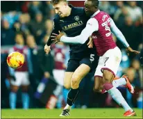  ??  ?? STEPPING UP: Angus MacDonald in action against Villa