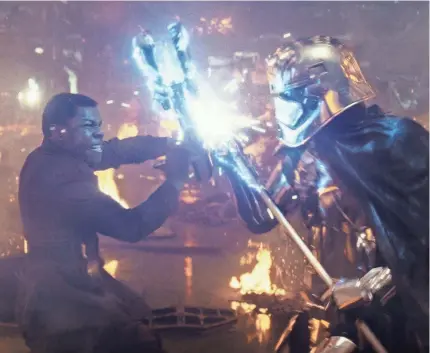  ??  ?? Tensions are high when Finn (John Boyega) battles Captain Phasma (Gwendoline Christie) in “The Last Jedi.” LUCASFILM