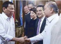  ??  ?? PLDT chairman Manny Pangilinan greets President Duterte.